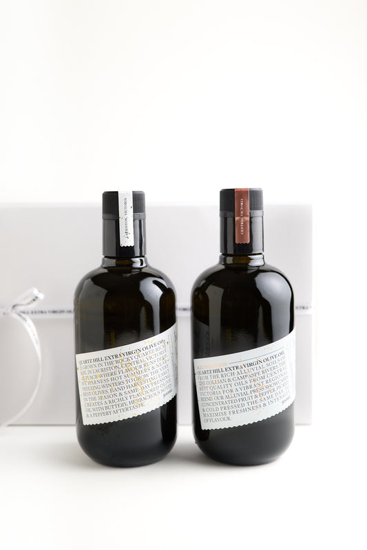 Mother’s Day gift ideas featuring two elegant bottles of cold-pressed olive oil - Estate Oil and Alluvial Press - perfect for foodies seeking wellness and flavour.