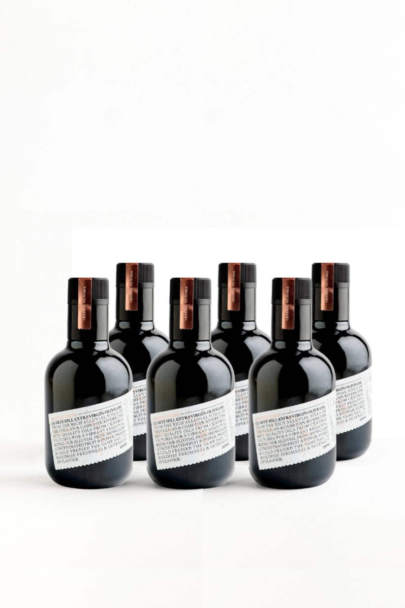 collection of 6 black bottles of high polyphenol olive oil in dark glass.