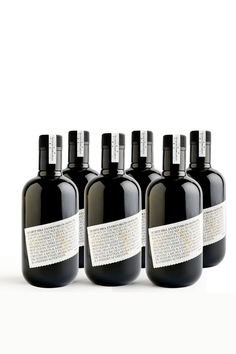 Six 500ml bottles of high polyphenol extra virgin olive oil for daily wellness in dark bottles with white label.