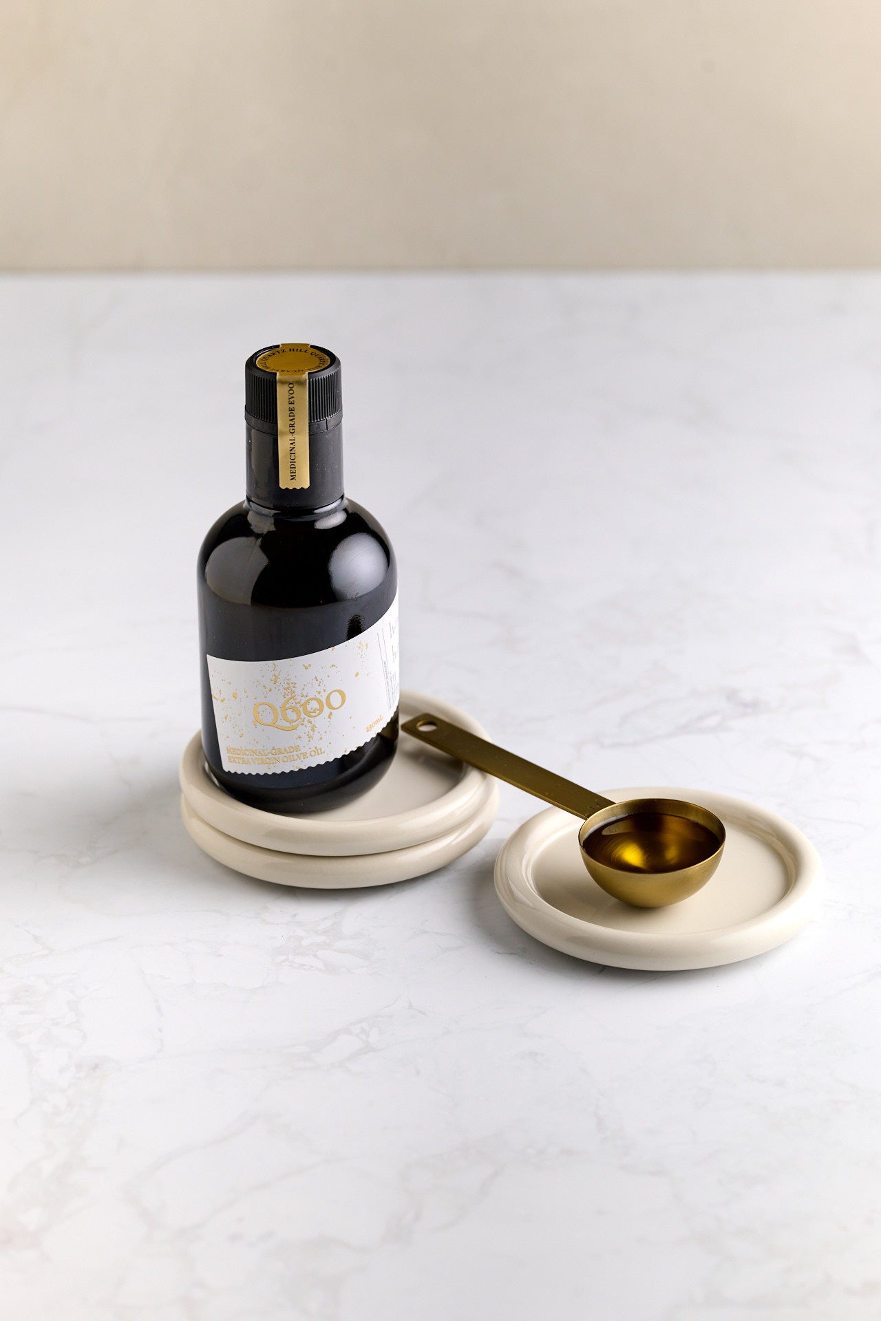 Q600 high-polyphenol olive oil poured onto a spoon, 634mg/kg cold pressed daily ritual EVOO Macedon Ranges