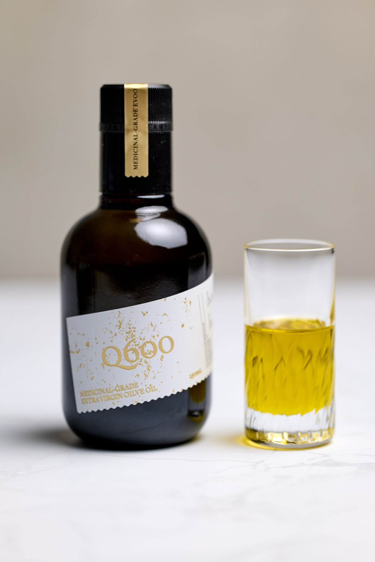 Q600 high-polyphenol olive oil 634mg/kg in shot glass, daily drinking olive oil shot ritual Macedon Ranges Australia