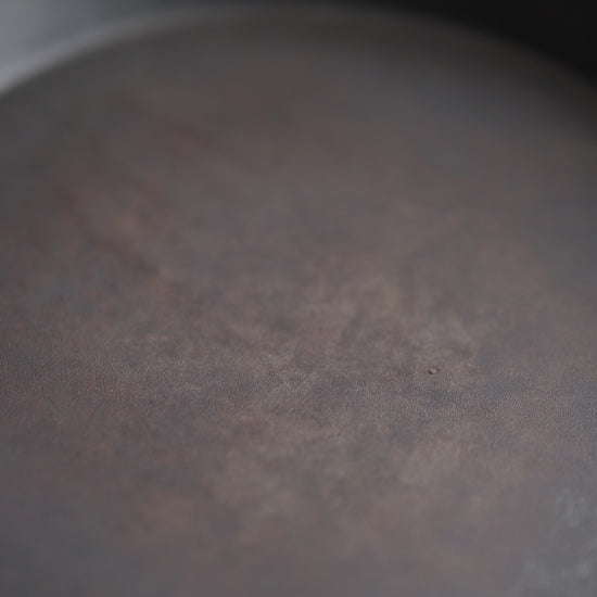 video of early harvest olive oil being poured onto a pan.