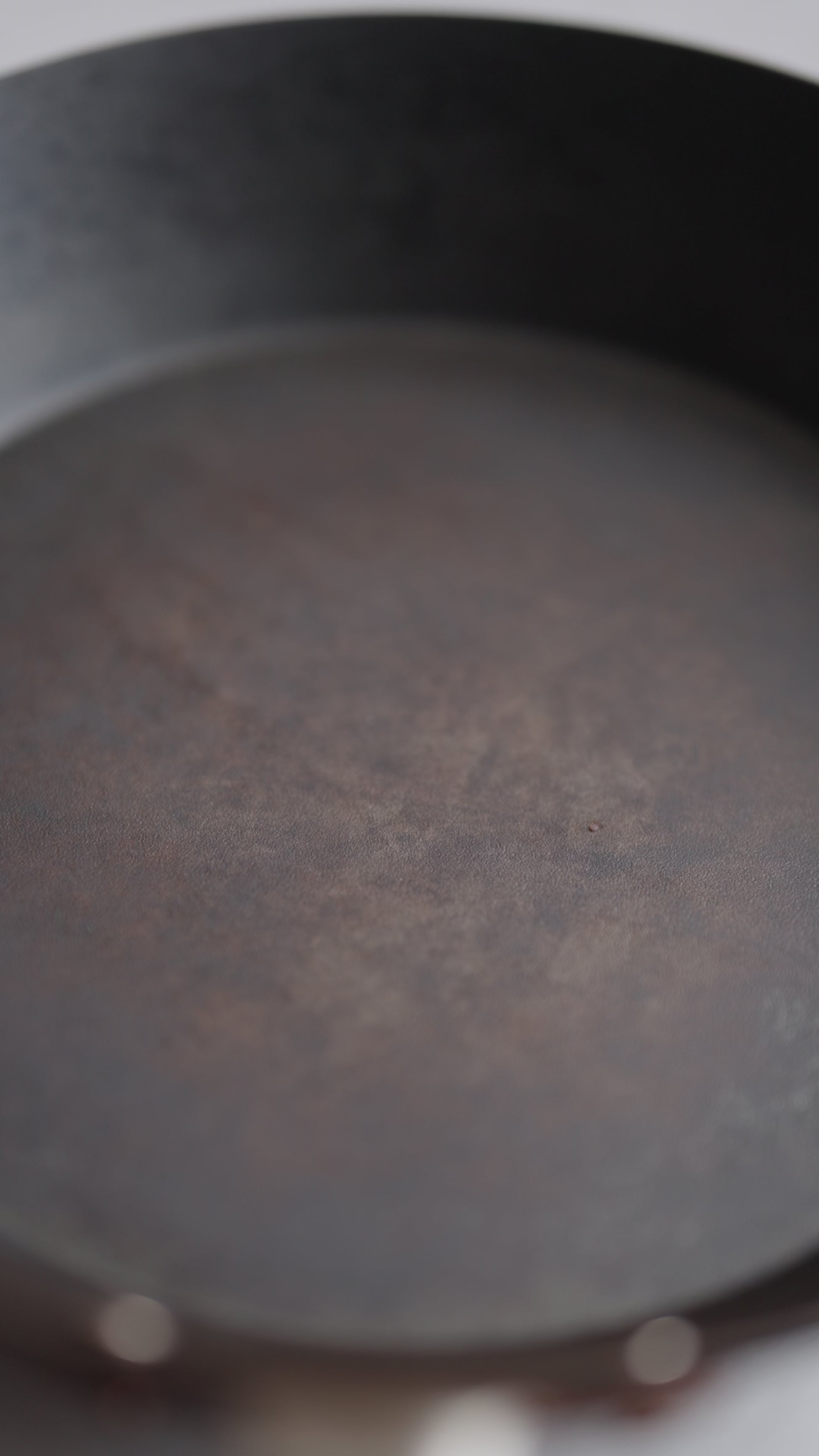 video of early harvest olive oil being poured onto a pan.